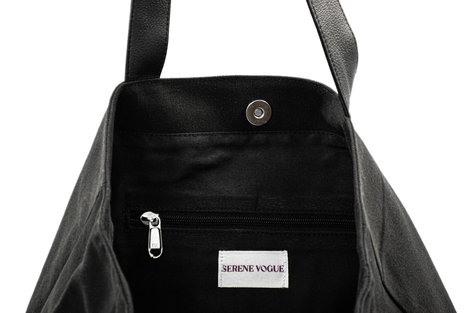 Elite Canvas Shopper Bag with Serene Vogue logo, reinforced handles, and inner zipper pocket