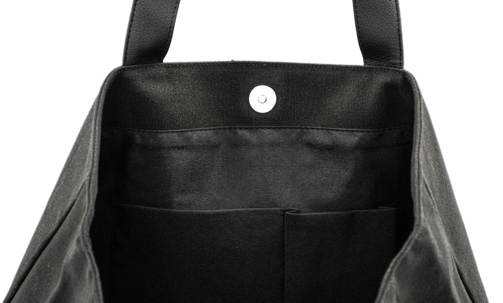 Elite Canvas Shopper Bag with Serene Vogue logo, reinforced handles, and inner zipper pocket