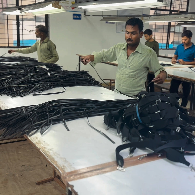 Meet the Hands Behind Your Bag_A look inside our factory in India, from the first cut to the final stitch_Every strap is checked by hand, the last quality check before your bag is packed.
