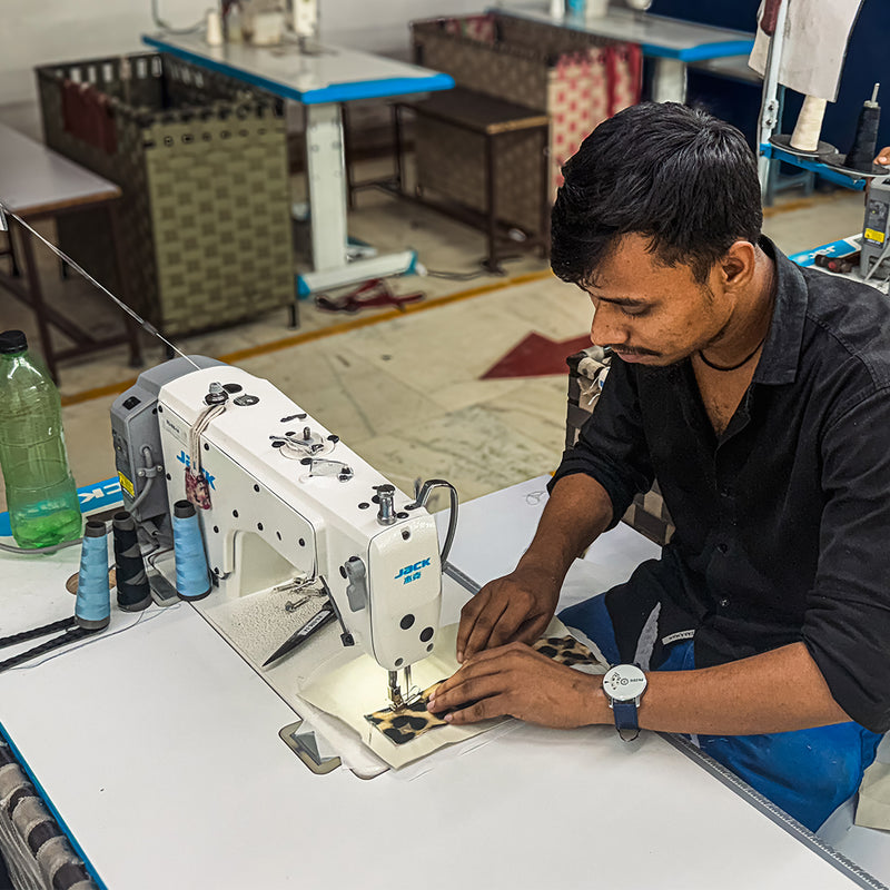 Meet the Hands Behind Your Bag_A look inside our factory in India, from the first cut to the final stitch_Every leopard-print seam is checked by hand before it moves on.